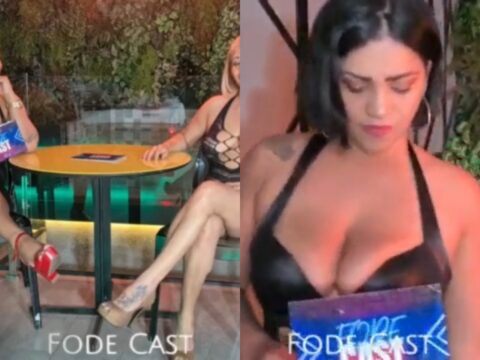 Duas putas semi nuas provocando e se exibindo durante uma entrevista