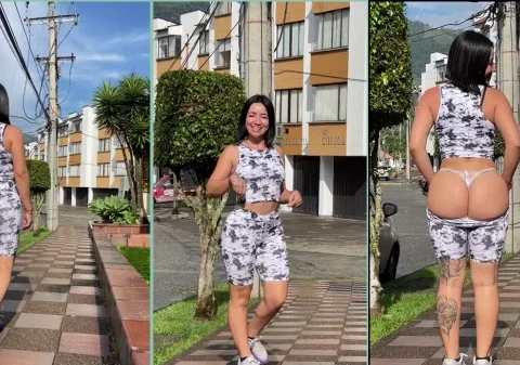 Moça muito linda abaixando a roupa em local público