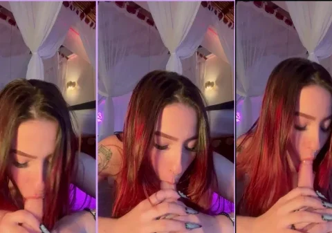 Safada simulando um boquete no pau de borracha