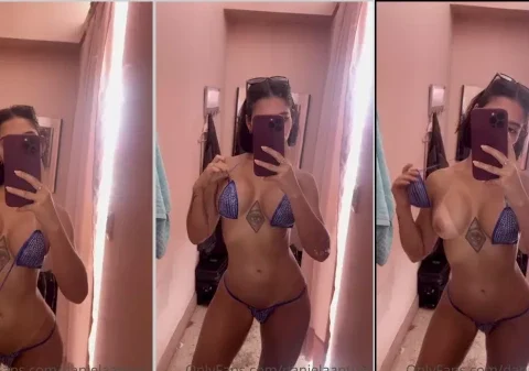 Colombiana safada tirando o biquíni para mostrar a marquinha de bronze